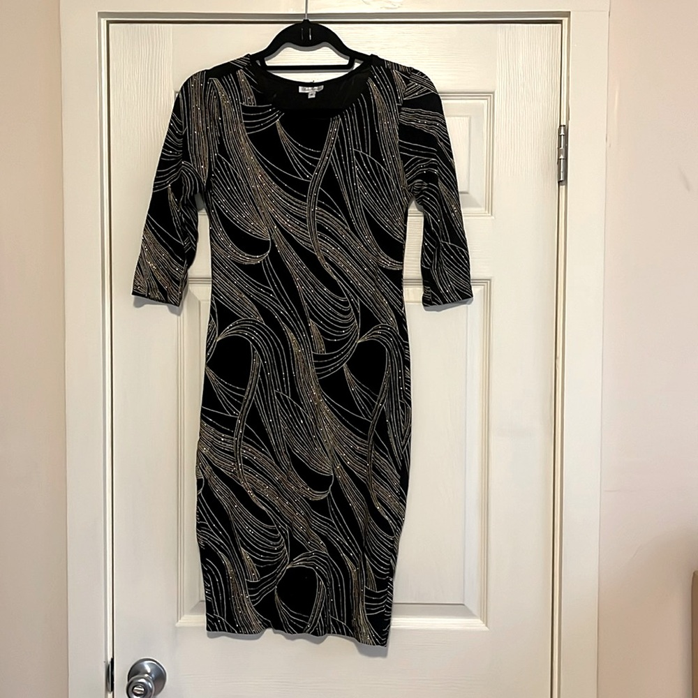 Olivia Matthew’s vintage glitter bodycon dress